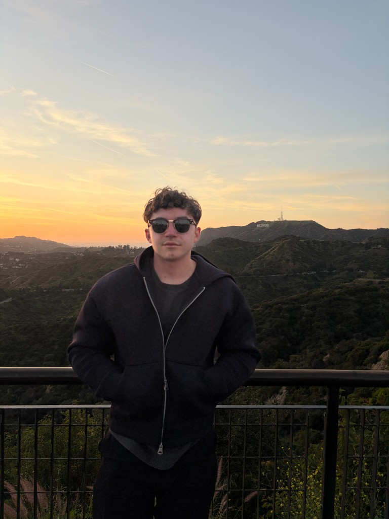 Erik standing at sunset in front of the Hollywood Hills